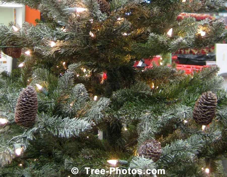 Artificial Christmas Tree Decorated With Christmas Lights And Pine Cones